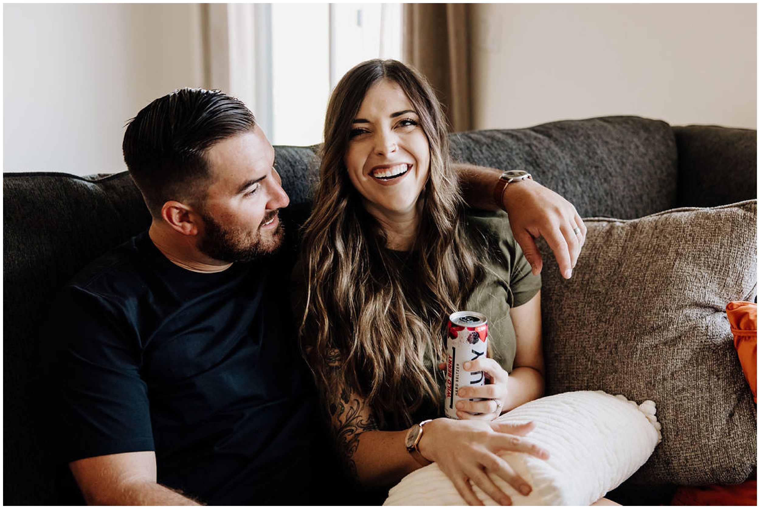 couple drinking on couch