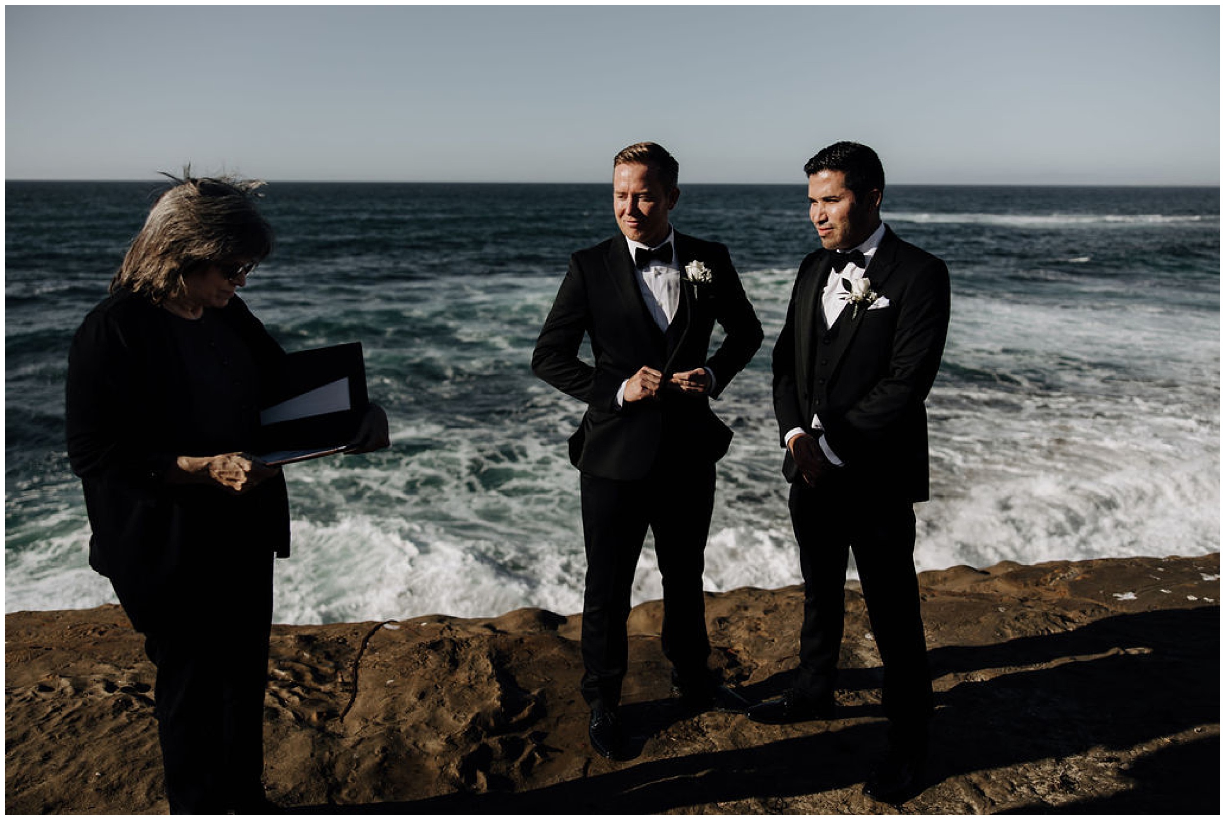 grooms getting married at the ocean
