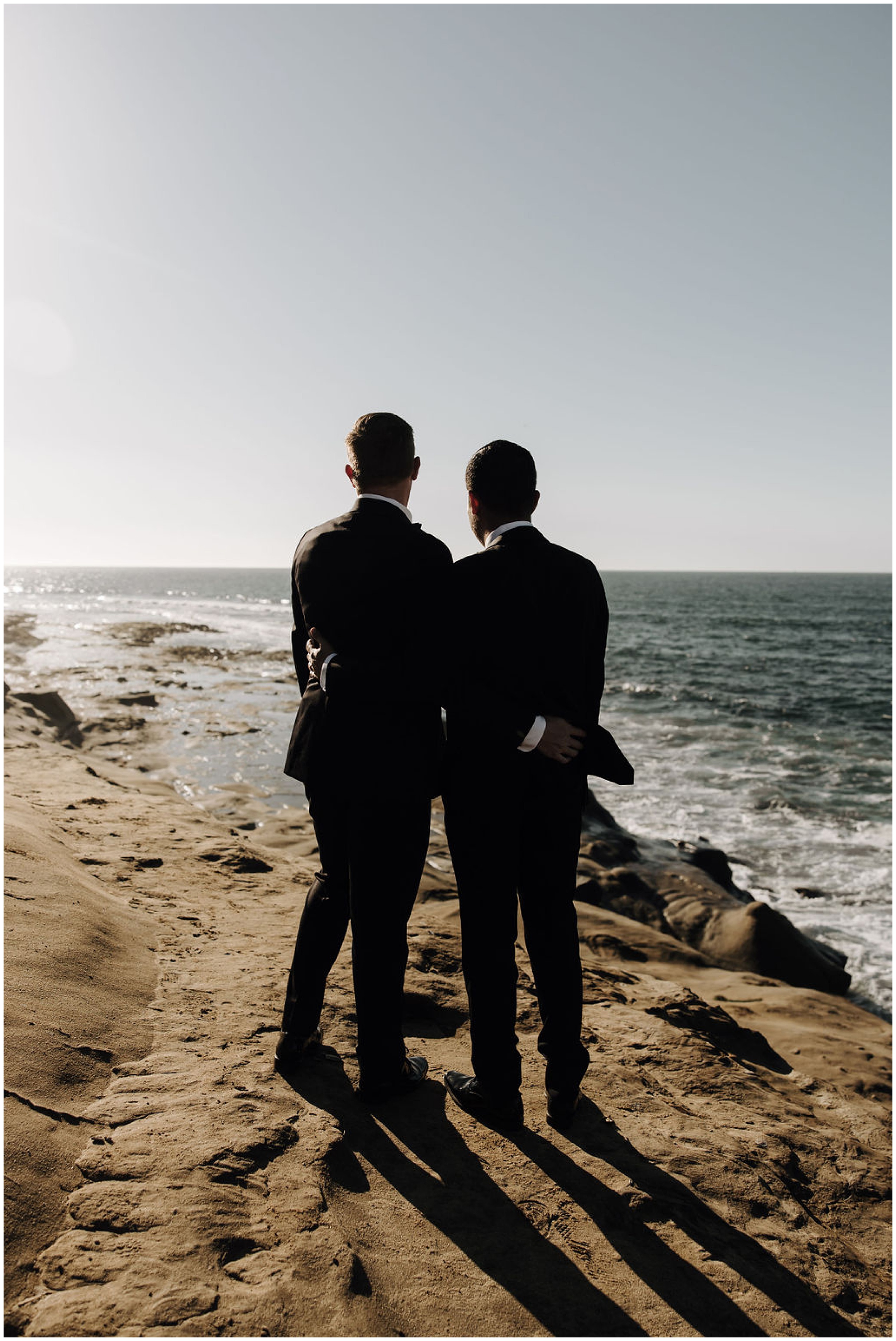 grooms looking out at the ocean