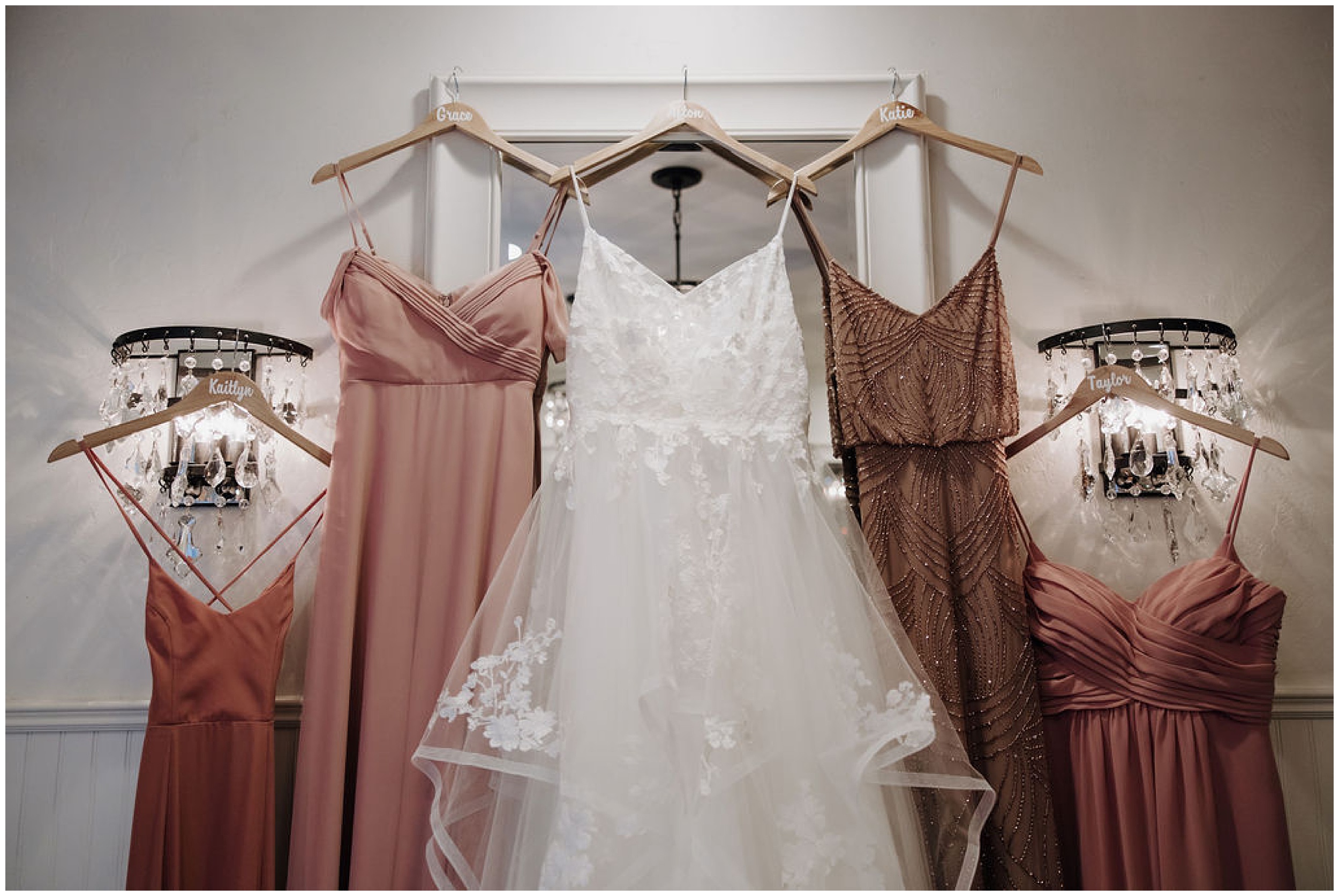 wedding dress and bridesmaids dresses hanging