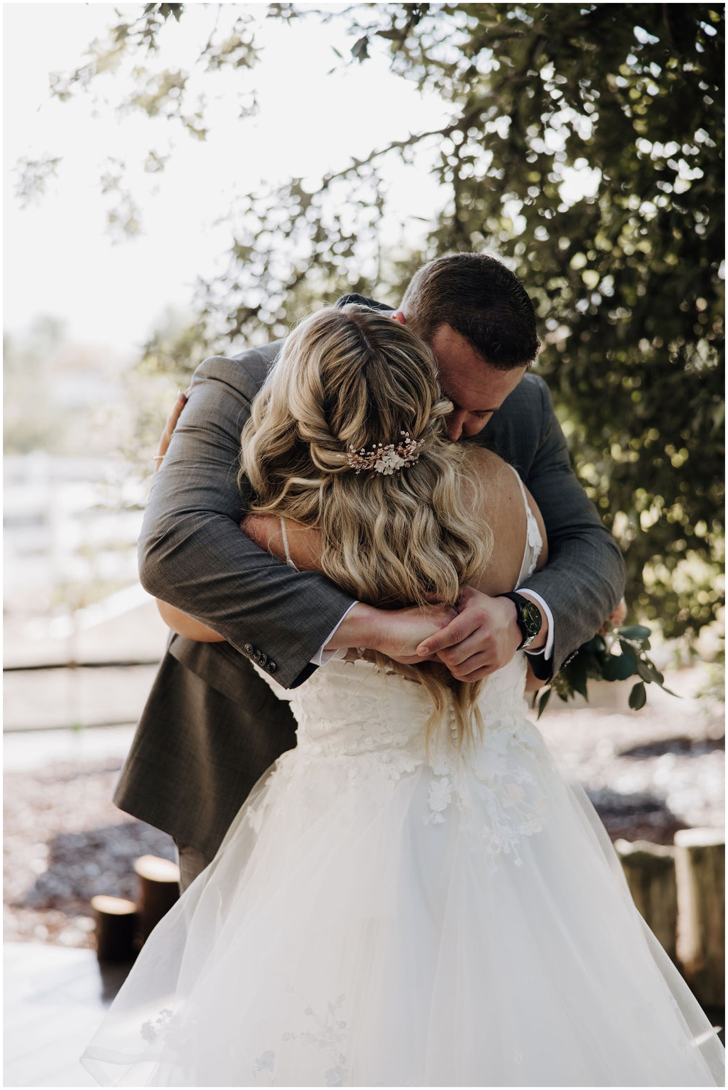 bride and groom hugging