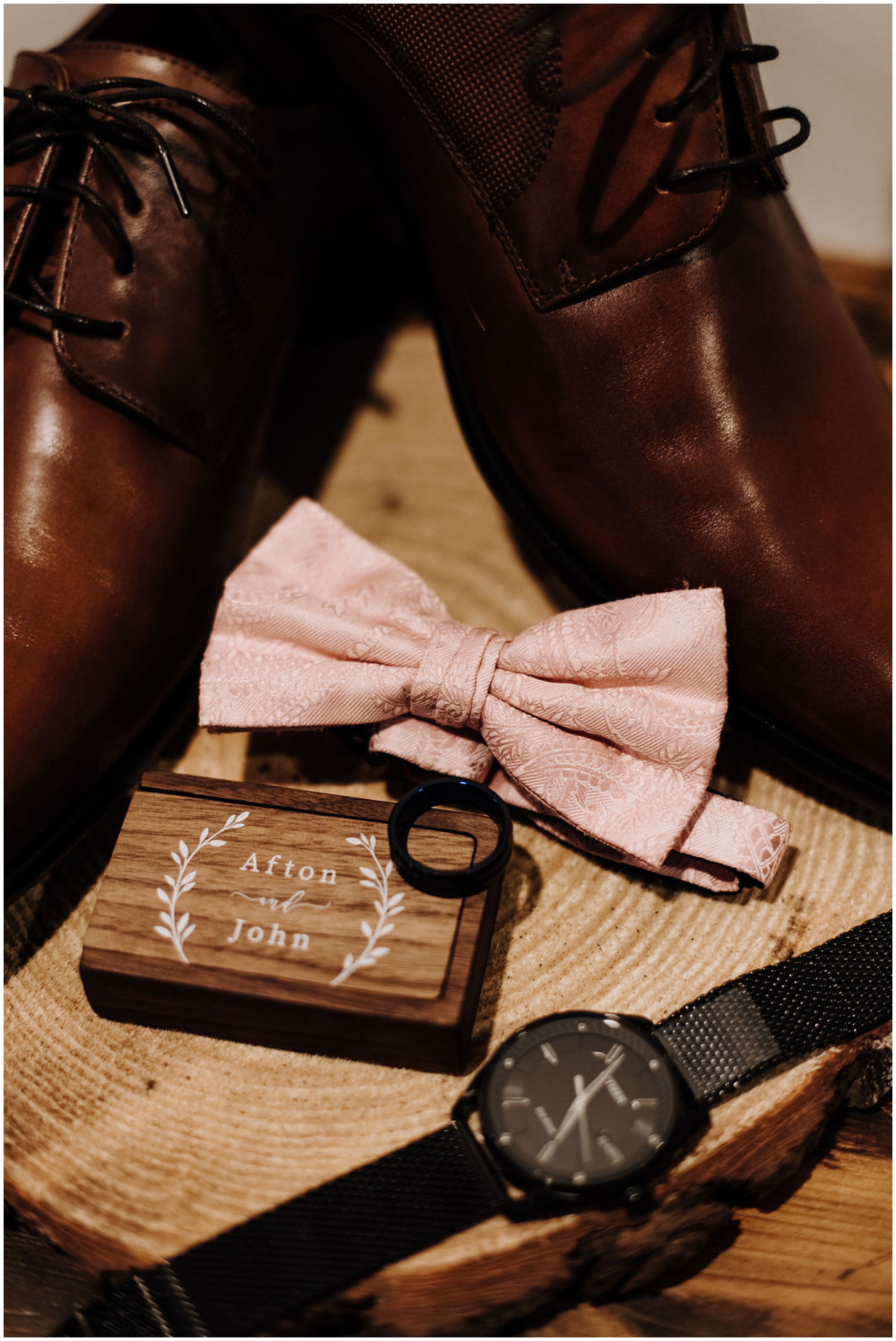 groom's bowtie with ring and shoes