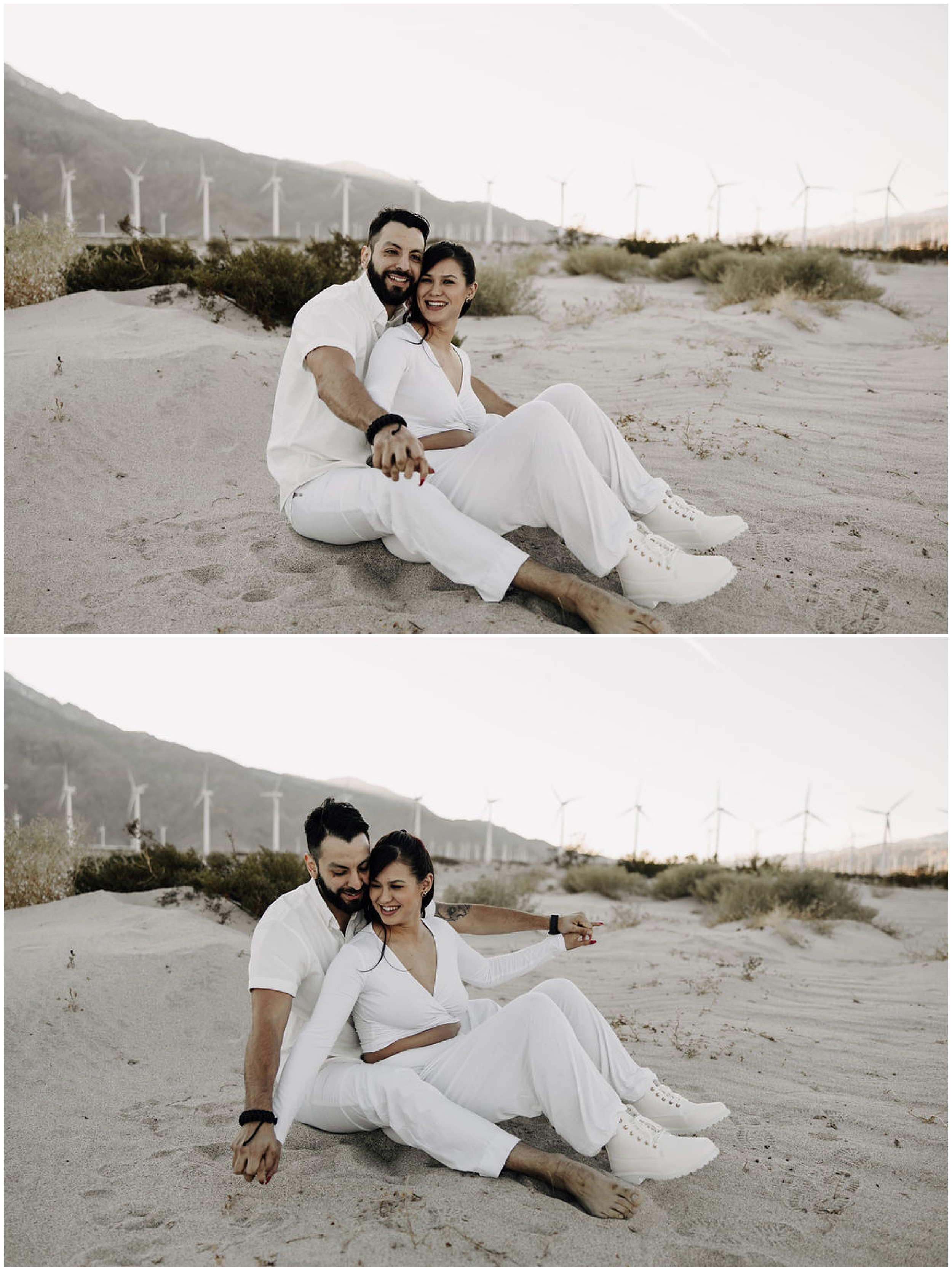 couple snuggling by windmills in desert