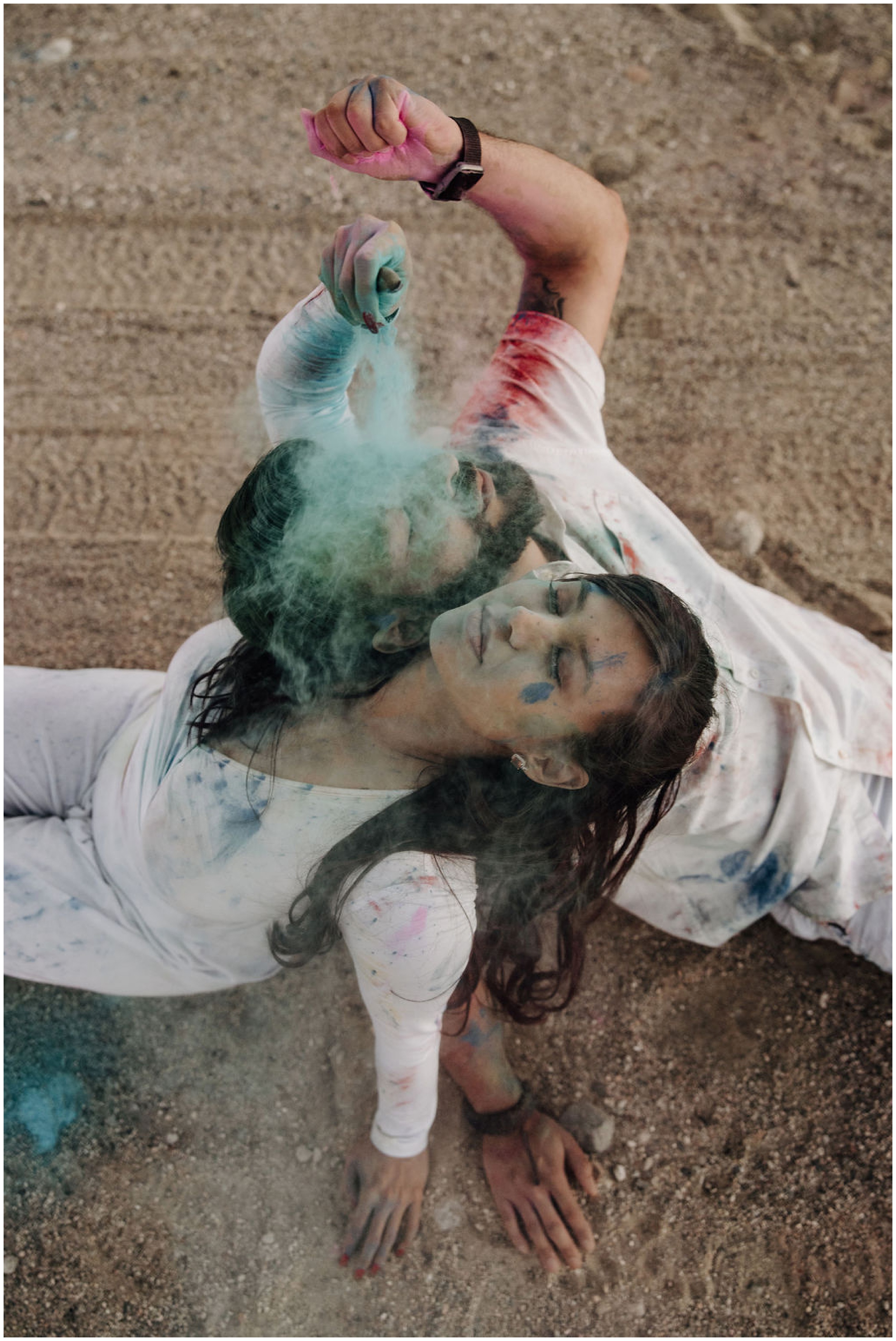 couple playing with colored powder