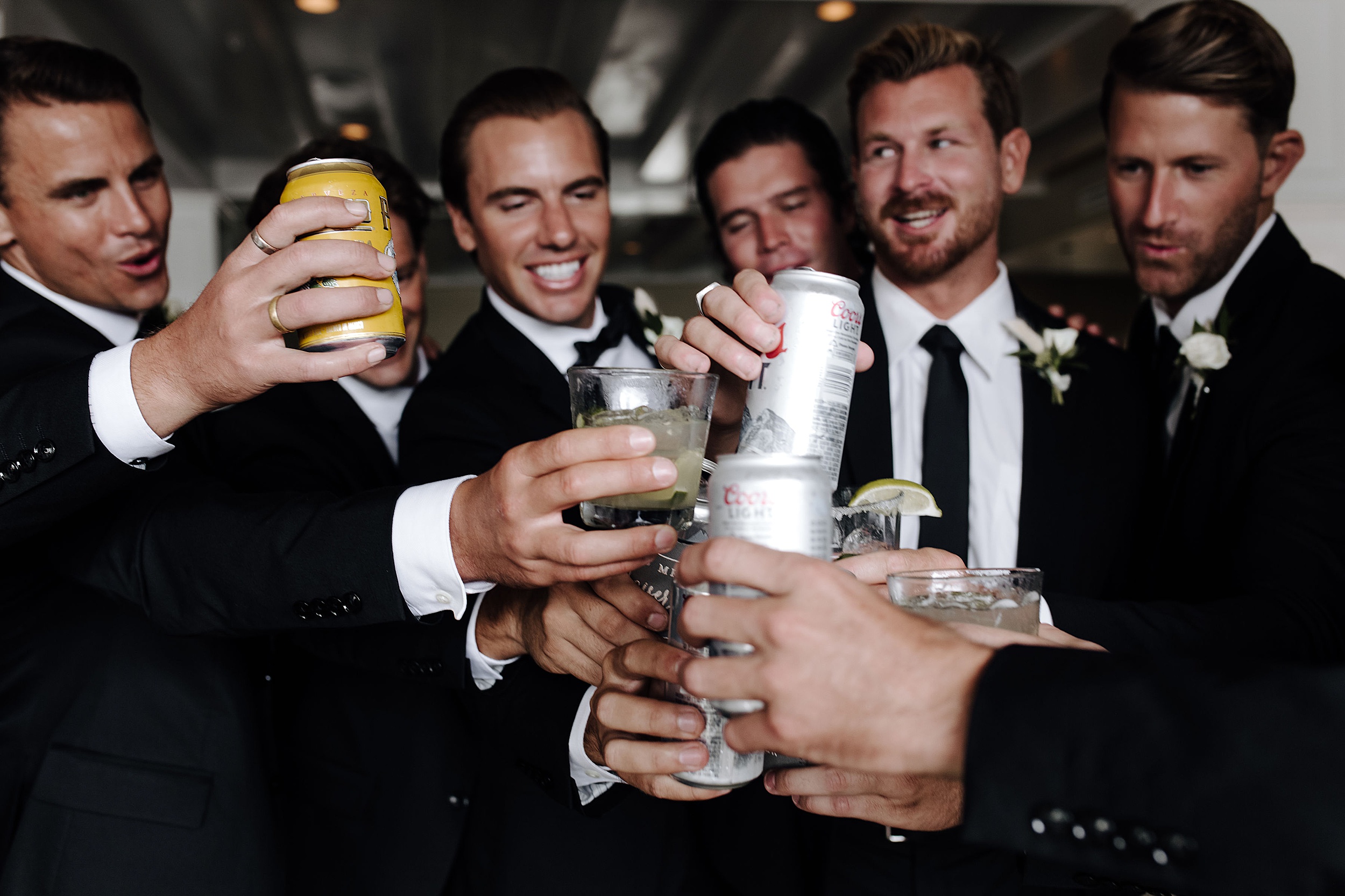 groomsmen toasting beers