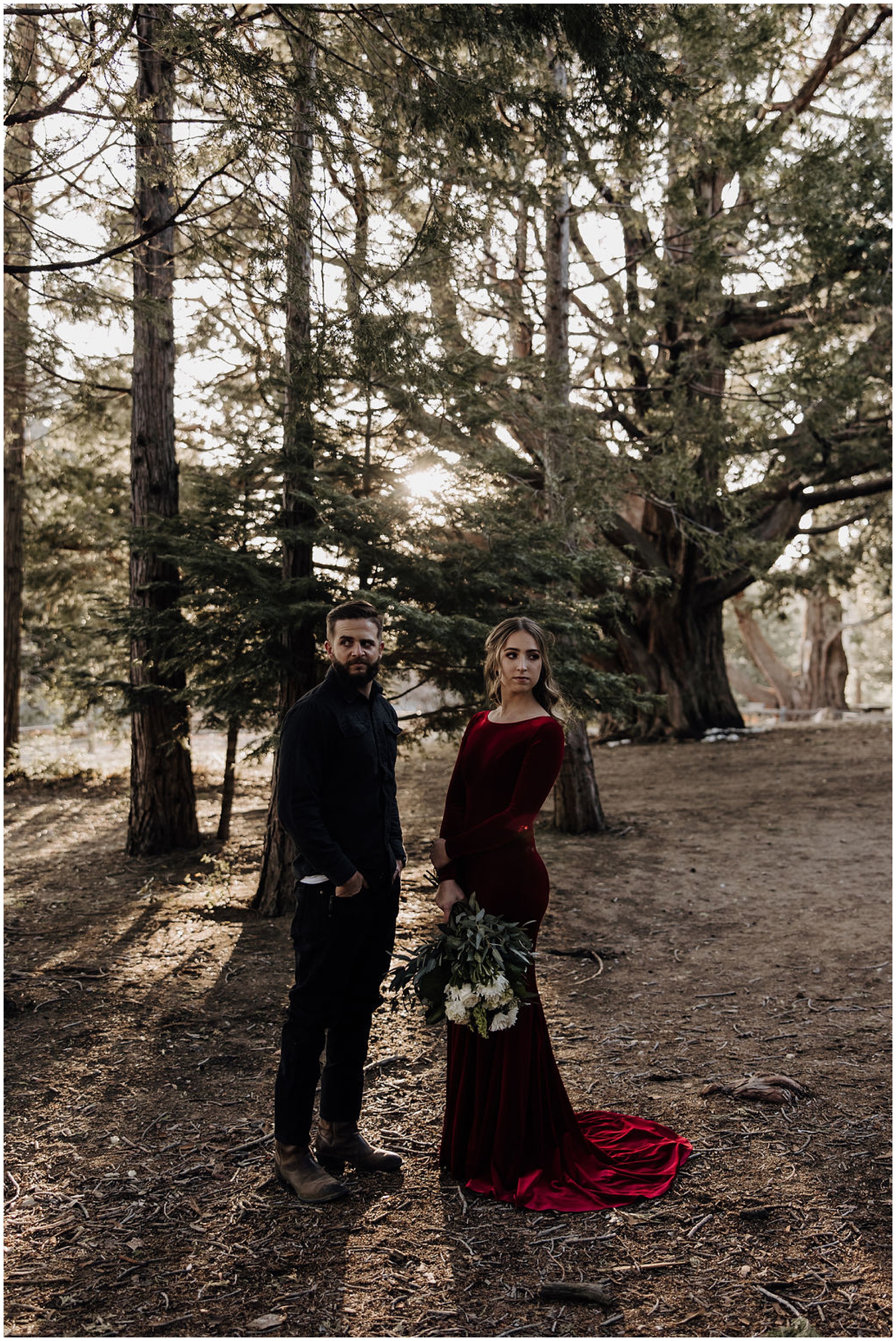 couple standing in forest